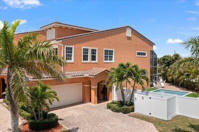 Discover beachside luxury in this beautifully designed 5-bedroom, 4.5-bath townhome with a private pool. Built with concrete block construction and hurricane-impact glass throughout, this residence features 12-foot ceilings and 8-foot doors for an open, elegant feel. Multiple primary suites (3 king, 2 queen) and expansive balconies offer comfort and space for family and guests. Located in a sought-after community just seconds from Starbucks, Publix, and Walmart, and within walking distance to quiet, private beaches and popular local restaurants. Only about an hour from Central Florida's world-famous theme parks, making it an ideal primary home, vacation retreat, or investment property. The air-conditioned two-car garage doubles as a game room, complete with a pool table, foosball,