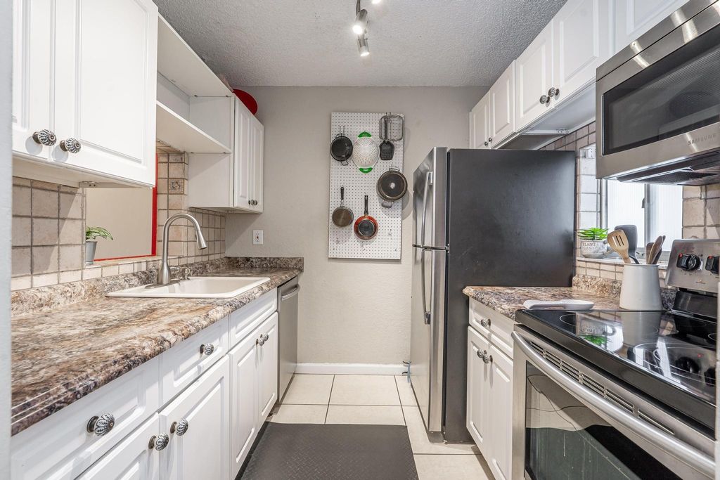 Photo of 7860 NW 50th St #307, Lauderhill, FL 33351 (MLS # F10511475)