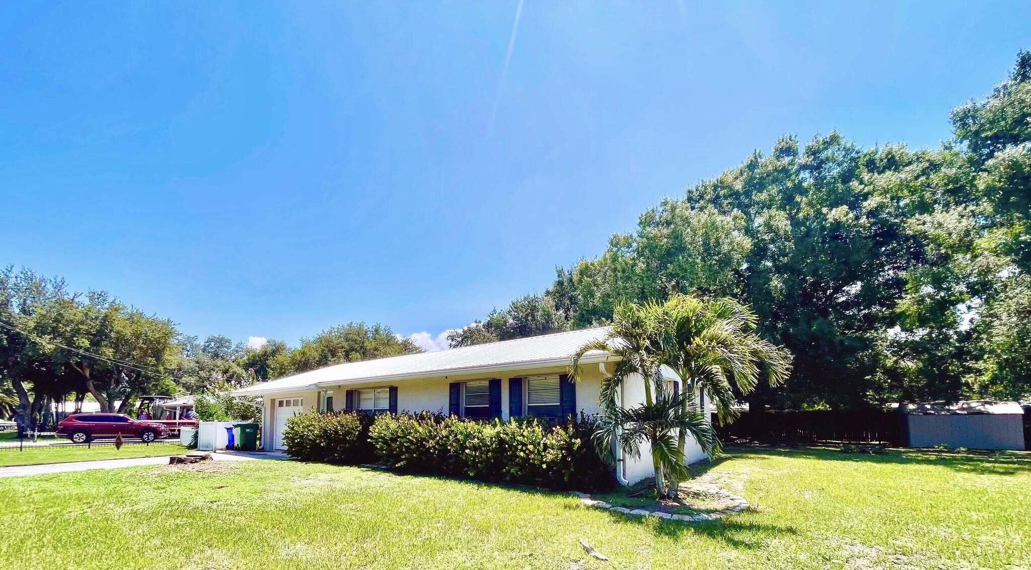 Welcome home! This charming home offers comfort, convenience, and timeless Florida charm- perfect for first-time homebuyers, snowbirds, or anyone looking to downsize without sacrificing quality. Spacious living area with great natural. light. Recessed lighting in the kitchen. Dedicated dining space or breakfast nook. Cozy yet functional layout. Clean, move-in ready condition. Huge fenced backyard ideal for pets or outdoor fun. Majestic mature oak tree for shade and ready for a hammock, or cozy bench swing. Screened-in patio perfect for morning coffee or evening gatherings. Virtual Staging Notice: Several photos have been virtually staged to showcase the home's layout and possibilities so you can truly picture yourself living here.