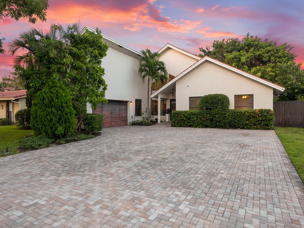 Photo of 875 NW 83rd Drive, Coral Springs, FL 33071 (MLS # B26082148)