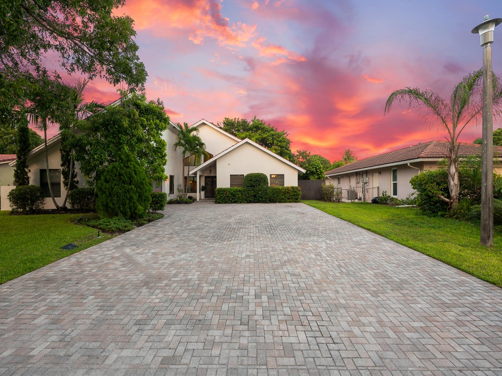 Photo of 875 NW 83rd Drive, Coral Springs, FL 33071 (MLS # B26082148)
