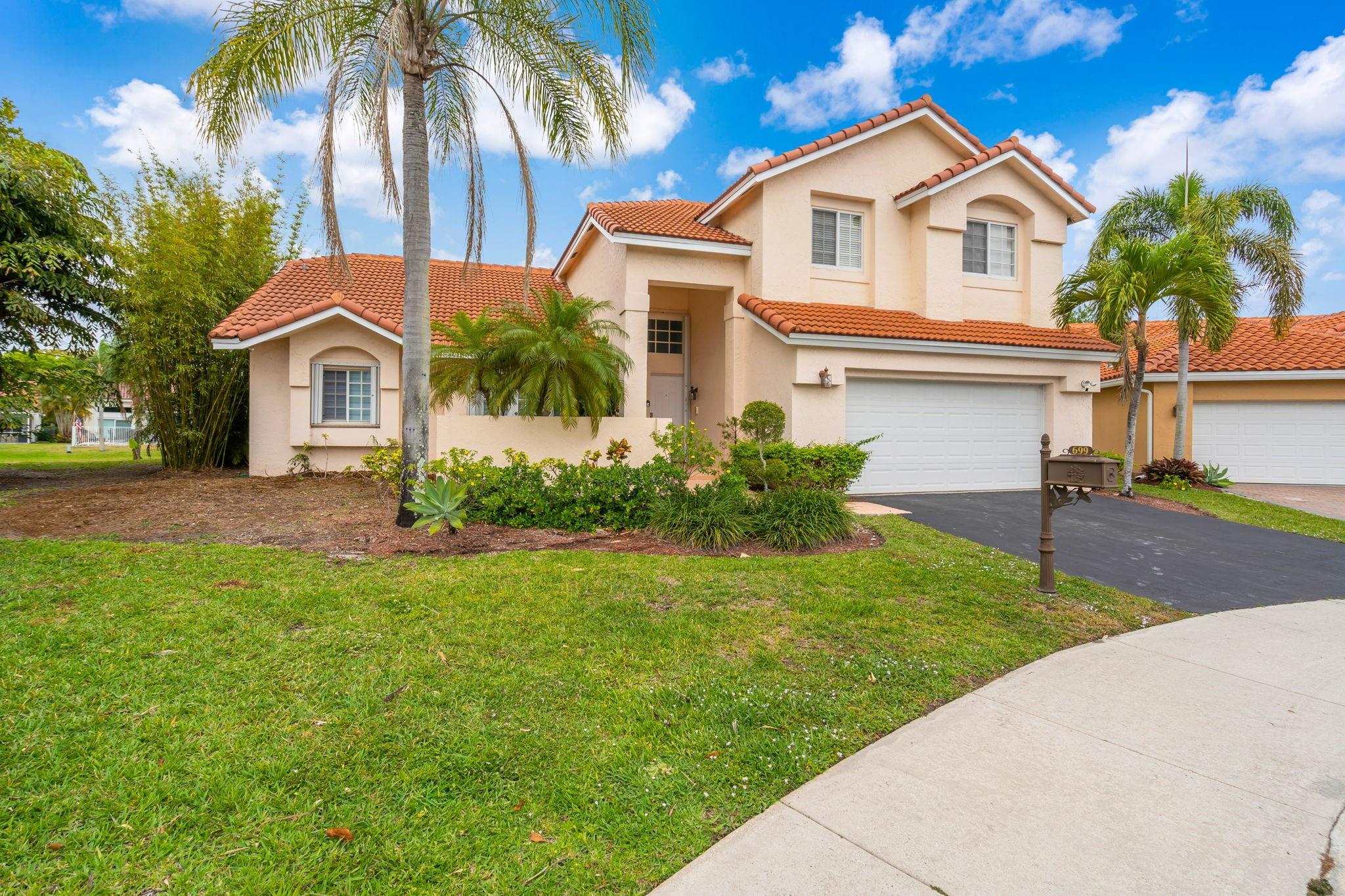 Welcome to your new home in Laguna Springs II in Weston. This is an Estancia model on an oversized 12,000 SF Lot, on a quiet cul-de-sac. Property located in a gated close knit community of under 100 homes. Interior has been recently updated, including all the bathrooms and the kitchen with newer appliances. House has hurricane protection including accordian shutters. There is an additional room that can used as a den, library, office or converted into a bedroom. House has a serene lake view with 150 feet of water frontage, as well as an assortment of fruit trees. Newer roof (2019) House within walking distance (<1 mile) of Chabad, churches, parks, schools and shopping centers.