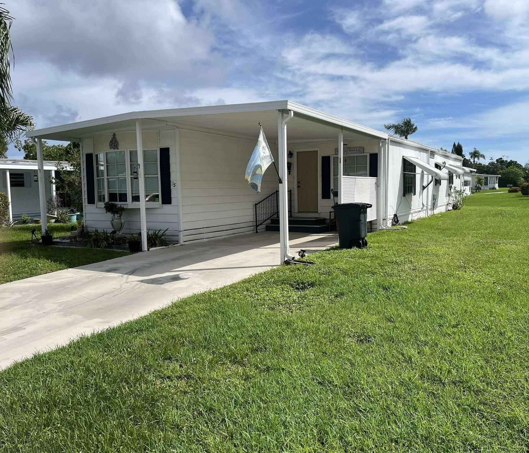 Welcome to 15 La Costa Lane, a charming 2-bedroom, 2-bath residence nestled in the active 55+ community of Spanish Lakes Golf Village in Port St. Lucie.  Spanning approximately 1,080 square feet, this home offers a thoughtfully laid-out floor plan with split bedrooms and an abundance of natural light.  The large screened Florida/sunroom adds flexible living space perfect for relaxing or entertaining in comfort.  Inside, find an indoor laundry area, ample storage, and generous living zones that serve both everyday life and social occasions.