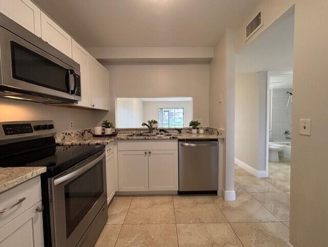 Fabulous central Boca Raton location! This 2-bedroom, 2-bath first-floor residence offers convenience and comfort across the street from the Boca Raton YMCA and just minutes to shopping, dining, A+ schools, and houses of worship. Featuring an updated kitchen and baths, freshly painted interior, and all tile flooring, the home is move-in ready. The primary suite includes a spacious walk-in closet, while the washer and dryer are conveniently located in a closet on the screened patio. Enjoy easy access to the community pool right out the back screen door. Rent includes water and basic cable. One assigned parking space and a guest spot.