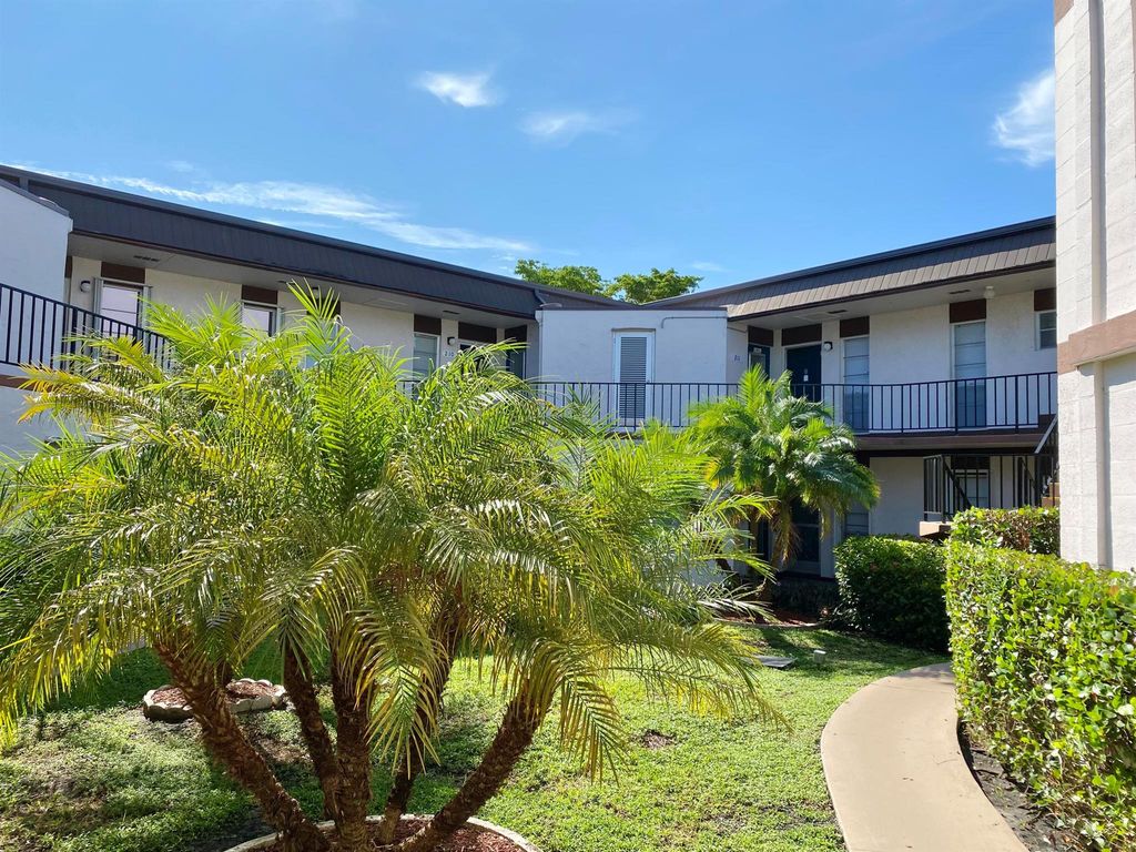 Photo of 7 Greenway Vlg N #211, Royal Palm Beach, FL 33411 (MLS # R11134324)