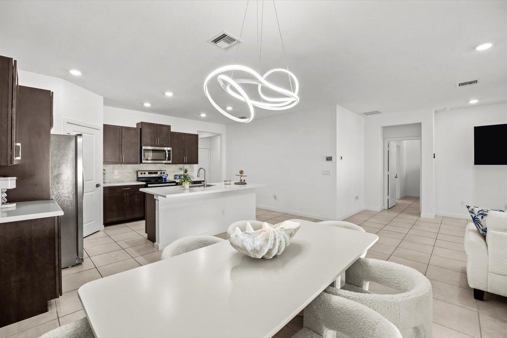 Photo of 1723 NE White Pine Terrace, Jensen Beach, FL 34957 (MLS # R11153610)
