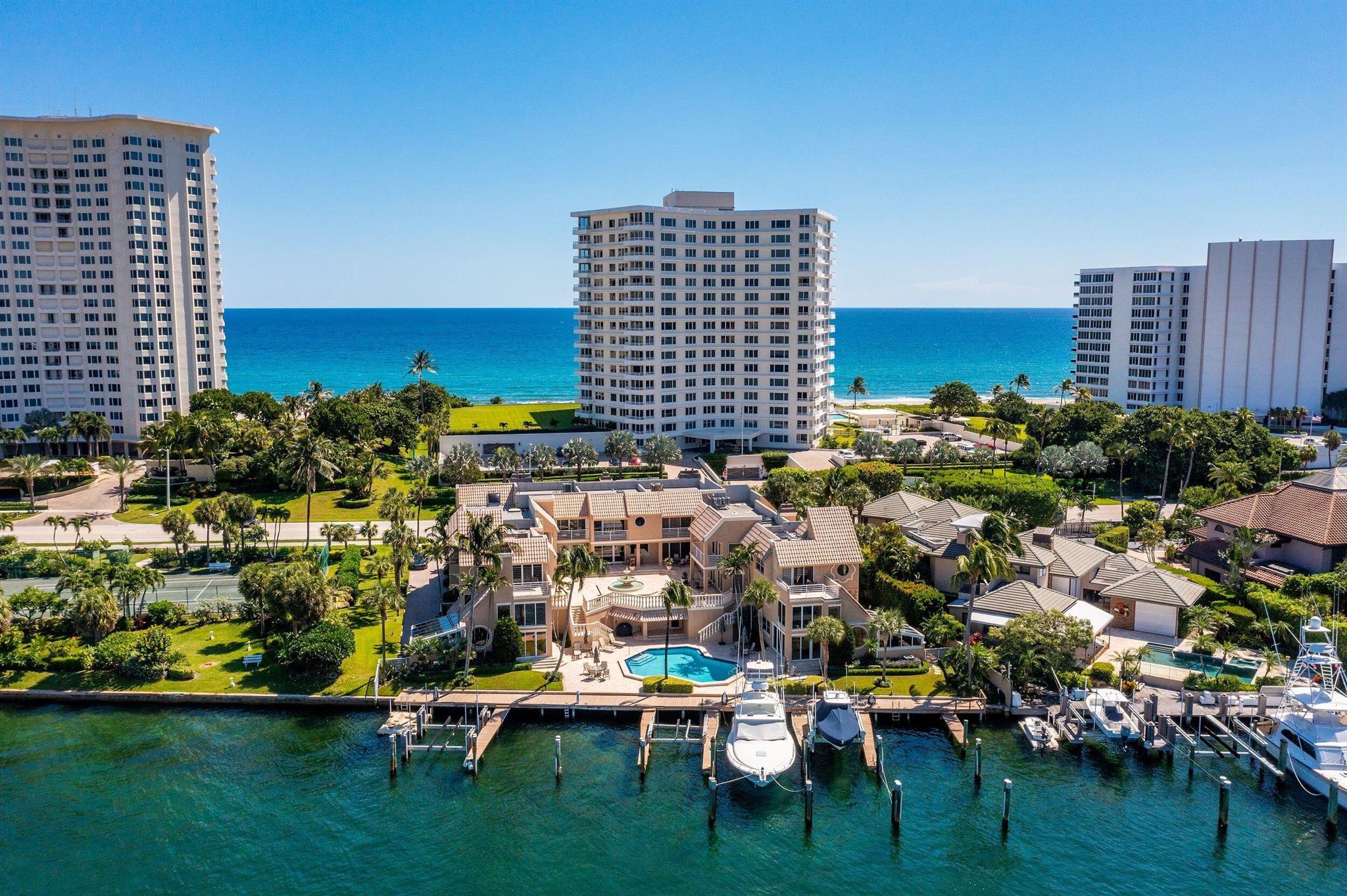 Lake Boca! Lake Boca! Lake Boca! Pristine water views from almost every room in this gorgeous 3 Bedroom 3.5 Bath fully upgraded three story townhome. One turn from the inlet, private pool, with a private dock for up to a 50 ft boat. Walkable to the beach, Boca Resort, and many great restaurants and shops. Master suite with private balcony, elevator access which services all 3 levels, and 2 assigned garage spaces. Come enjoy the cooling water views and South Florida sun from this amazing townhome perfectly situated in Reflections on Lake Boca.