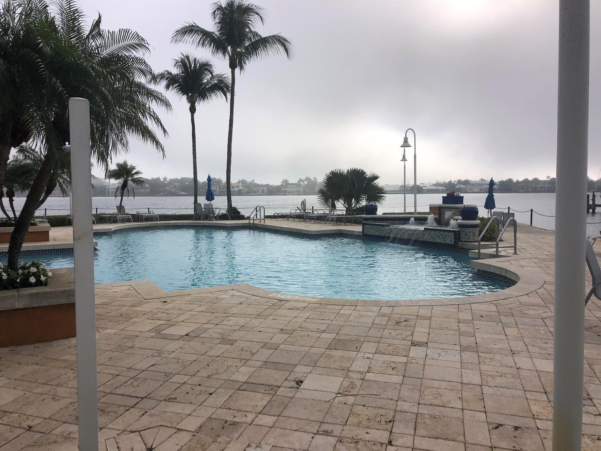 : Light & bright courtyard 2/1 condo located on 26-acres of intracoastal paradise. Desirable third floor unit with vaulted ceilings, laminate wood floors in the living areas, in breathtaking Intracoastal gated community that boasts two swimming pools, Jacuzzi, tennis court, volleyball court, marina with private boat lifts possibly available for rent upscale business center, Tiki bar, fitness center, clubhouse, dog park, fishing, and intracoastal access. The Yacht Club on the Intracoastal is within minutes of the beautiful sandy beaches. Watch million dollar yachts while sipping on your favorite drink by the pool. Walk by the marina in the evening to enjoy the beautiful sunset! Call now for your private showing!
