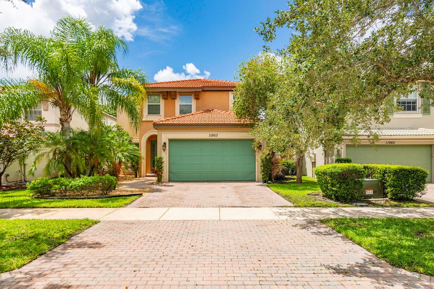 One of the best opportunities in Tradition right now. This move in ready CBS home sits just one mile from Downtown Tradition and offers an open layout for everyday living and entertaining, with no direct neighbors across the street for added privacy and curb appeal. The kitchen features granite countertops, stainless steel appliances, custom cabinetry, and LED lighting. Upstairs, the spacious primary suite includes high ceilings, dual walk in closets, a frameless glass shower, and soaking tub. Outside, enjoy a fully fenced backyard with a covered patio, pergola, and fresh landscaping, set up for relaxing or hosting. Located in gated TownPark with resort style amenities including pool, spa, fitness center, tennis, pickleball, and bocce. HOA includes cable, internet, alarm, and security.