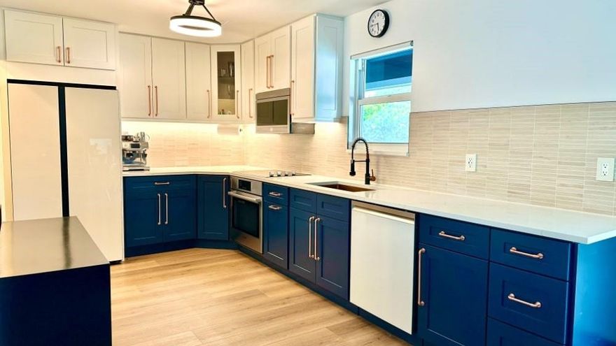 Welcome to 2135 / 2137 Dock Street—a beautifully renovated cottage-style multi-family duplex in the heart of Downtown WPB. A combined 1,700 sq ft of modern, turnkey space, it's ideal for both homeowners and investors. Each unit (2/2 and 2/1.5) has central a/c, smart appliances, furniture, new kitchens,floors,sprinklers, impact windows & doors, in-unit laundry, and private entry—perfect for long-term tenants, short-term guests, or multi-gen living. Each unit previously earned $4k-$5k/month as a short-term rental. Enjoy low-maintenance living with a 450 sq ft garage with private entrance and bathroom, automatic front gate, screened patio, 8ft hedges, EV Charger, landscape lighting, fenced 0.21-acre lot, 950 sq ft of artificial grass, new roof and solar system (w/$0 monthly energy costs).