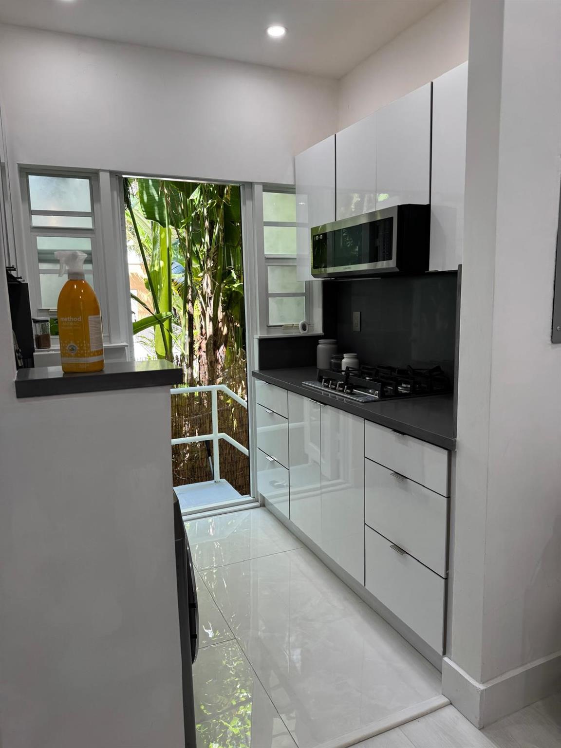 Completely updated 1-bedroom, 1-bath corner condo unit. Fully renovated, featuring impact windows, a spacious living room, and a patio