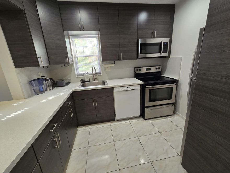 Large 1 bedroom 1.5 bath ground floor apartment with a huge walk-in closet in a great location! European style kitchen cabinets and stainless steel appliances. Walk to Starbucks, Walmart, Panera Bread, Big Lots, Publix, and Winn Dixie! Close to Gulfstream. You can even walk over the bridge to the beach! Convenient to Airports and is where Hallandale Beach Boulevard intersects with Three Islands Blvd. Reserved parking spot and guest parking. Swimming pool. Only first and security deposit to move-in plus Association deposit of $1000. Association approval is not based on credit score. Partially furnished if desired.