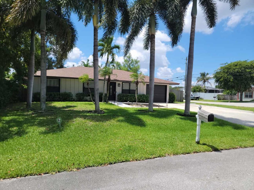 Photo of 3390 Artesian Drive, Lake Worth, FL 33462 (MLS # B26022837)