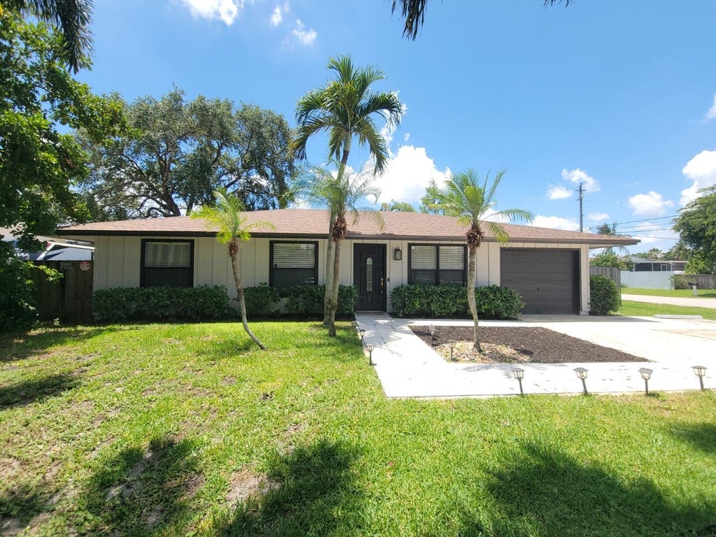 Photo of 3390 Artesian Drive, Lake Worth, FL 33462 (MLS # B26022837)