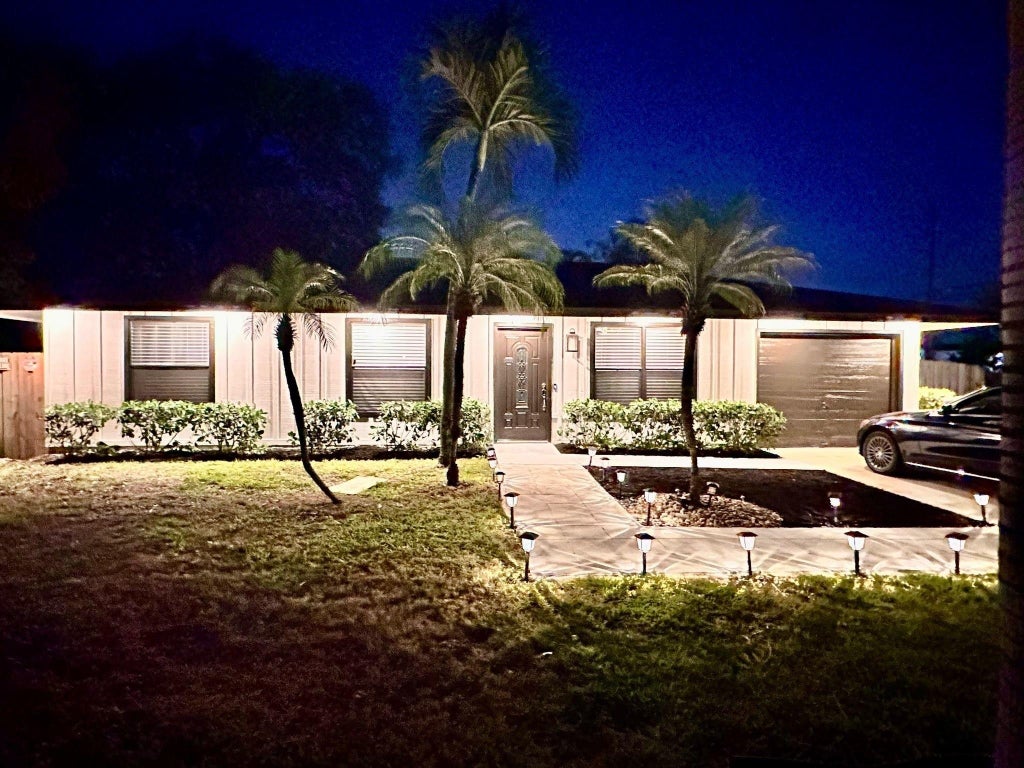 Photo of 3390 Artesian Drive, Lake Worth, FL 33462 (MLS # B26022837)