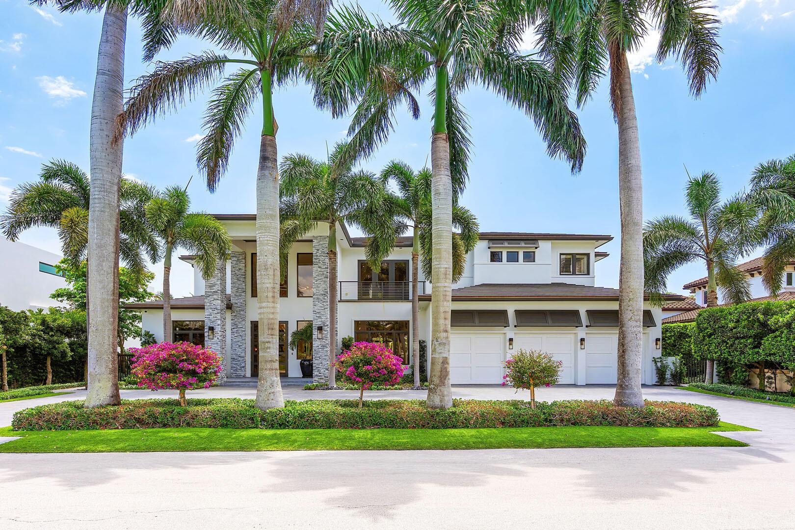 A rare opportunity to own one of only 14 exclusive residences within the prestigious Royal Palm Yacht & Country Club, offering uninterrupted front and rear vistas of the Jack Nicklaus Signature golf course. The interiors have been masterfully redesigned by renowned designer Michael Gray, showcasing a refined sensibility.Step inside to find a dramatic entry that unfolds into a grand living space anchored by a striking floor-to-ceiling fireplace. The interiors are defined by custom architectural details, designer lighting, and curated wall treatments, all grounded by sleek white porcelain flooring on the main level.Designed with both comfort and entertaining in mind, this four-bedroom home features a generous open layout that includes a sophisticated media lounge, a private study,