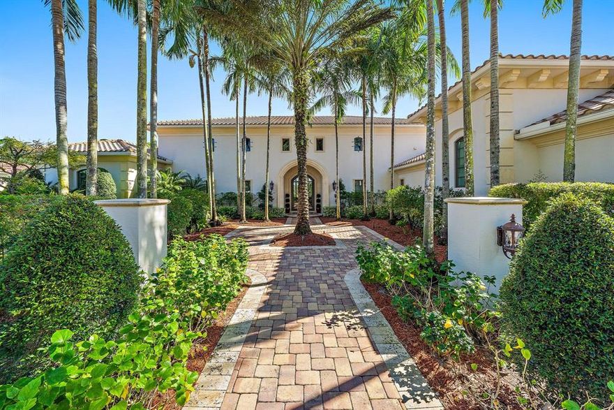 Beautifully designed custom home situated on a 1 acre homesite with a spectacular vast view of the 12th hole of the Raymond Floyd designed golf course. The open kitchen features a butler's pantry, Thermador double wall ovens, 2 dishwashers, 2 islands w/2 sinks. Wet bar w/refridge, ice maker & wine closet. The spacious master suite includes his & her baths and custom closets. The handsome office displays built-in book shelves & cabinets w/a view of your own private oasis. A perfect entertaining home w/fireplace, summer kitchen, marble pavers, lap pool & plenty of seating under the covered lanai w/speakers through out. This meticulously  maintained 5BR/6.2 BA home includes 2 comfortable VIP rooms and 2 ample guest suites and plenty of storage space. This is a must see in Old Palm Golf Club!