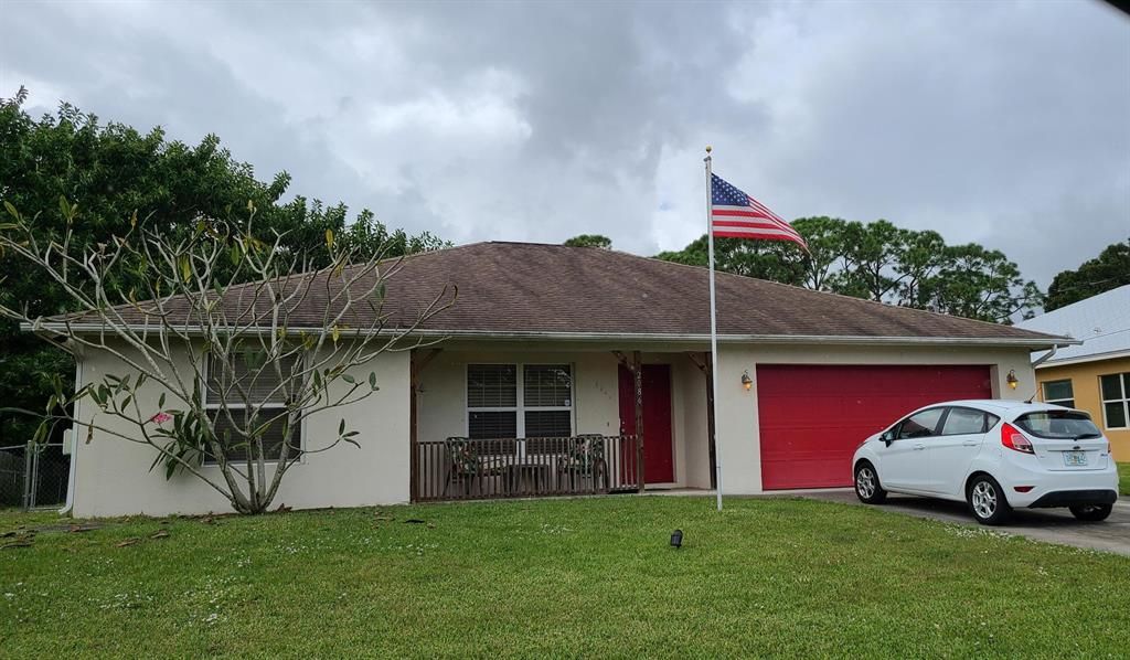 Photo of 2086 SW Idaho Lane, Port Saint Lucie, FL 34953 (MLS # R10759911)