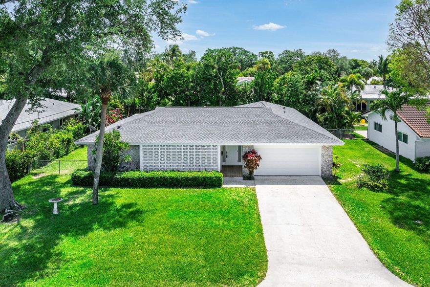 East Boca's charming Lake Floresta neighborhood is adjacent to Boca Raton's historic Old Floresta - this 4 bedroom, 2 bath house is an excellent opportunity to renovate and there is space to add additional square footage and / or add a pool to the property. The property has 2024 roof, new garage door 2025 and exterior repainting in 2026. Additional interior repainting just completed. Popular split bedroom floor plan.  Original terrazzo is currently exposed and ready for refinishing if that is your style! Large covered screened in porch overlooking spacious backyard.  Close in to downtown and the beaches and currently zoned for Addison Mizner Elementary, Boca Raton Middle and Boca Raton High School.