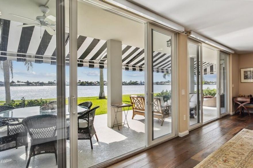 DIRECT WATERFRONT! A rare opportunity to own an exceptionally reimagined waterfront residence, this 4-bedroom, 4-bath ground-floor home at Chateau Cheverny captures the essence of refined coastal living. Meticulously renovated in 2020, this double-sized condominium offers an impressive 2,592 square feet of barrier-free elegance and the unmistakable feeling of a private home--all set against the backdrop of the majestic Intracoastal Waterway.Step into this well-situated condo unit with French oak floors into a world of timeless sophistication. The grand living room unfolds toward an expansive lanai, where manicured lawns meet endless blue horizons.Every detail has been curated for both beauty and comfort. Custom lighting, motorized blinds, and high ceilings enhance the sense of ...