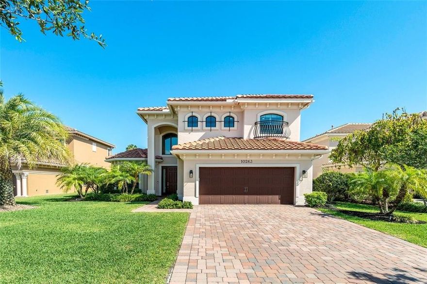 Luxurious resort-style living awaits with this simply beautiful home sited in one of South Florida's most upscale communities. Soaring 2-story ceilings, walls of impact windows/doors, and clean lines have resulted in a light & airy home. The fabulous great room area features a crisp white kitchen with quartz counters & top-shelf appliances including a gas stove. The spacious Primary suite is private & includes a sitting area/spa-like bathroom with his/her vanities & separate spa tub/shower. Upstairs is a loft, huge multi-purpose room, & 2 bedrooms. The private backyard is expansive and offers a pool with a sunning shelf and splendid outdoor living spaces. The 5th bedroom is an office. Enjoy world-class amenities & a short walk to the neighborhood elementary school.