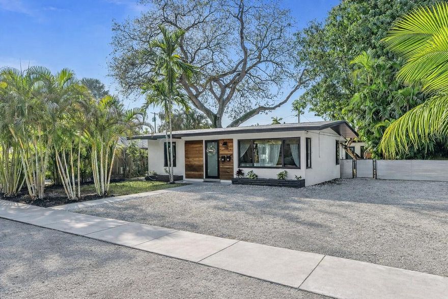 Beautifully Renovated Home with Detached Income-Producing Guest House in Croissant Park! Updated 3-bedroom, 2-bath property featuring a 2/1 main residence plus a fully detached 1/1 guest house with separate electric meters. Main home offers vaulted ceilings, updated kitchen and baths, tile flooring, hurricane impact windows, and a newly permitted screened patio. Rear guest house has private entrance and outdoor space for excellent separation. -------------------------------------------------------------------------------------------------------------------------------             OH Sunday March 22 12-2 PM --------------------------------------------------------------------------------------------------- The rear unit is currently generating $2,000+/month as a medium-term rental, with the front residence projected around $2,500-$2700/month. Short-term rentals are permitted in the area, offering additional income upside. Furnishings negotiable for a potential turnkey setup.------------------------------------------------------------------------------------ Both residences were extensively renovated and upgraded in recent years, including: • New roof (2021) • Central A/C (2021) • Tankless water heaters (2021) • Hurricane impact windows (2021) • Renovated kitchens & baths (2021) • New electrical panels & service drop (2024) • Newly permitted screened patio (2024) • Updated appliances (2023-2025) • Smart keyless entry locks • Tropical landscaping with lighting • Plenty of parking or space for RV/boat • No HOA Minutes from Las Olas, downtown Fort Lauderdale, beaches, FTL Airport, Port Everglades, I-95, and Whole Foods.