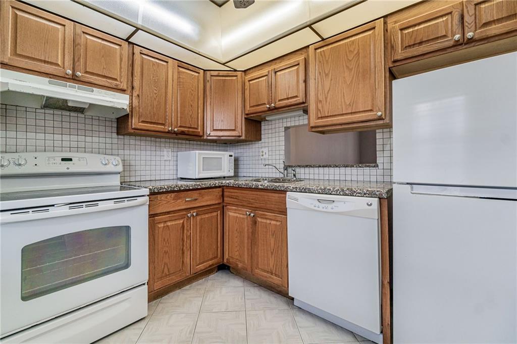 Nice First Floor Corner 1/1.5 unit with garden view. Newer spacious kitchen with breakfast nook. The living room extended to a screened patio with garden views. The exterior door from the patio provided easy access to the pool area and walkways. Freshly painted and ready to move in. The community has a property manager on site. Parking will not be an issue and dozens of 24/7 security cameras. Amenities include a heated pool, saunas, jacuzzi, picnic/BBQ area, and shuffleboard. Multiple washers and dryers on each floor. 55+ community.