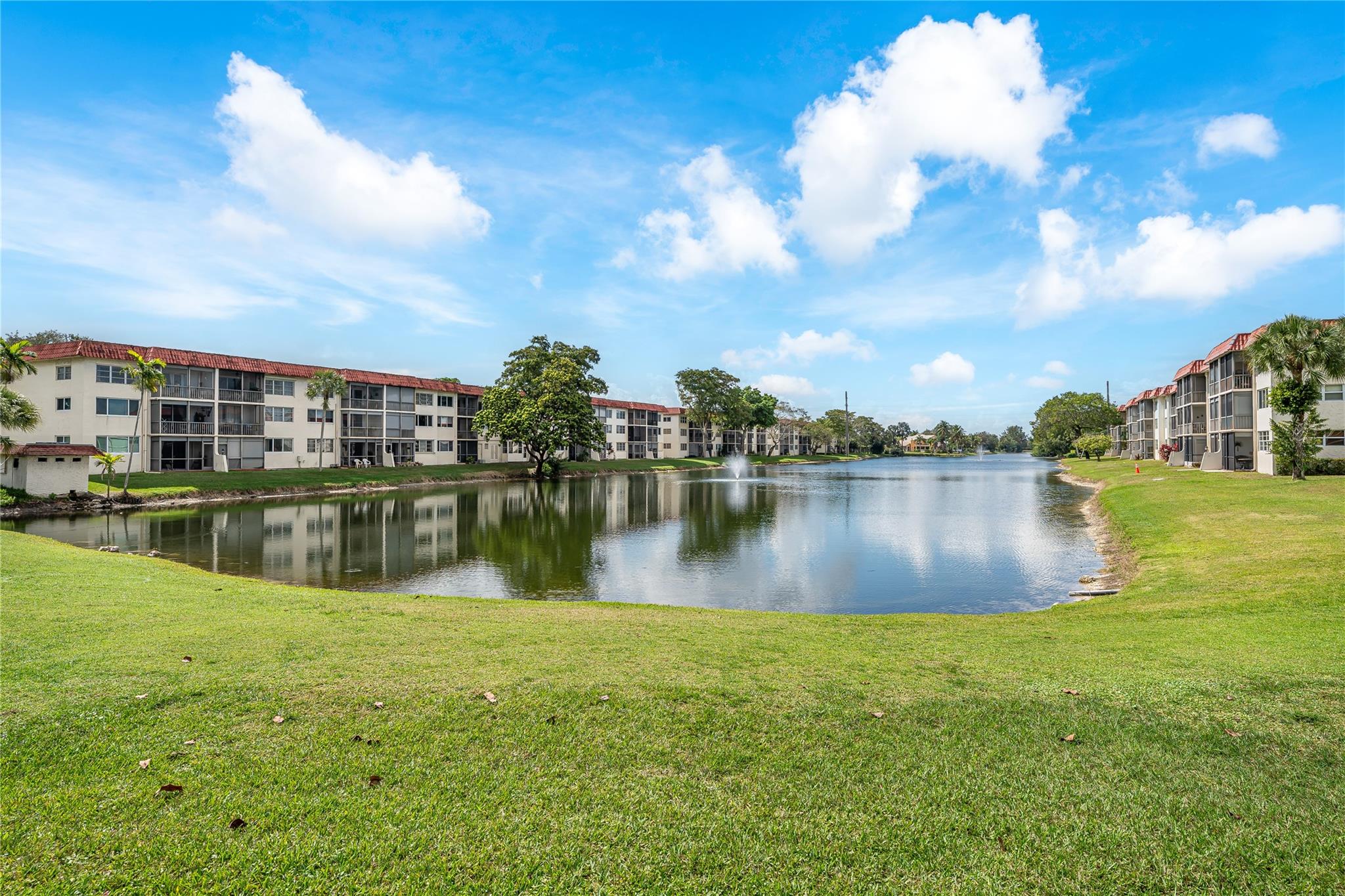 ENJOY THE BEST SUNSET VIEW OVER LONG-WIDE LAKE & PAR 3 course (17th green) & 10TH GREEN in front. 2nd Floor 2BR/2BA. 1,170 SF with Pool/BBQ across the street. Large ceramic tiles throughout. SEMI-WIDE OPEN KITCHEN featuring SS Appliances, Quartz Countertops, wide passthrough and extra storage. FULLY FURNISHED! Recreation Lease PAID IN FULL. Amenities include Restaurant, Billiard Room, Bbq/Picnic Area, Clubhouse, Courtesy Bus, Exercise Room, Heated Pool, Library, Putting Green, Sauna, Shuffleboard, Tennis, Pickle Ball, Vehicle Wash Area, Electric Car Charging Station. Close to shopping, dining & highways. 15 min. to the beach. BEAUTIFUL AND MOVE-IN READY! PRICED RIGHT!