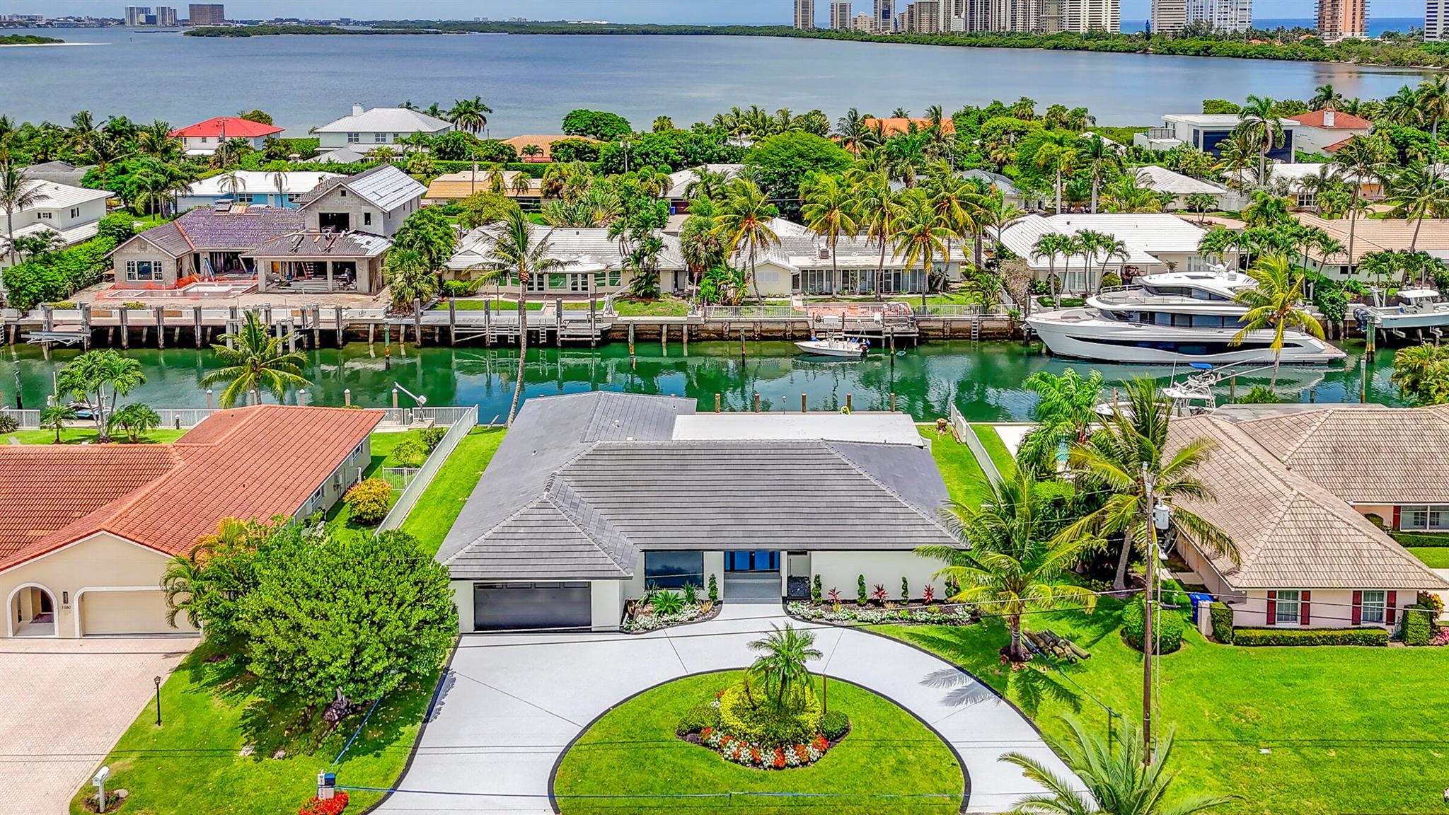 Fully Remodeled Home with 100' of waterfront with new 80' dock, new roof, new Impact windows and doors, new flooring through-out home. New Kitchen and bathrooms. Home is completely remodeled and will be completed near end of August/Beginning of September 2025.