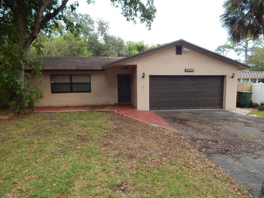 Beautifully updated 3 bedroom home with a remodeled granite & stainless steel kitchen and impact windows. Large Master bedroom has remodeled bathroom + Walk-In closet. All tile - No carpet.   Homes sits back on an oversized, fully fenced lot with long driveway. There is a 2 car garage with loads of storage + a large storage shed in the back yard. ** Lawn maintenance & exterior pest extermination are included in the rent. No Pets please.