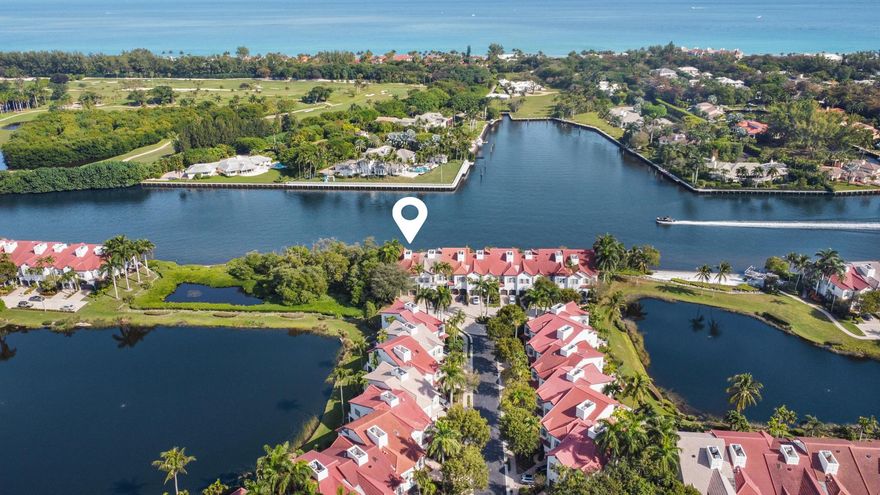 Enjoy unending water views from this DIRECT INTRACOASTAL TOWNHOME in the very best location in all of the ESTUARY!This END UNIT offers an expansive patio facing the INTRACOASTAL, in addition to exceptional privacy with a natural green barrier on the north side and a brick paver side yard.Desirable two story model is complete with plantation shutters, volume ceilings, crown moulding and an elevator. With three bedrooms and two and a half baths, this spacious floor plan features marble flooring on the first floor, and wood on the second. A large covered patio off of the Living Room enjoys  unsurpassed INTRACOASTAL views, looking across to the estate section of GULF STREAM, and the ocean beyond. The elegant Primary Suite offers a private balcony, a sitting area, and two