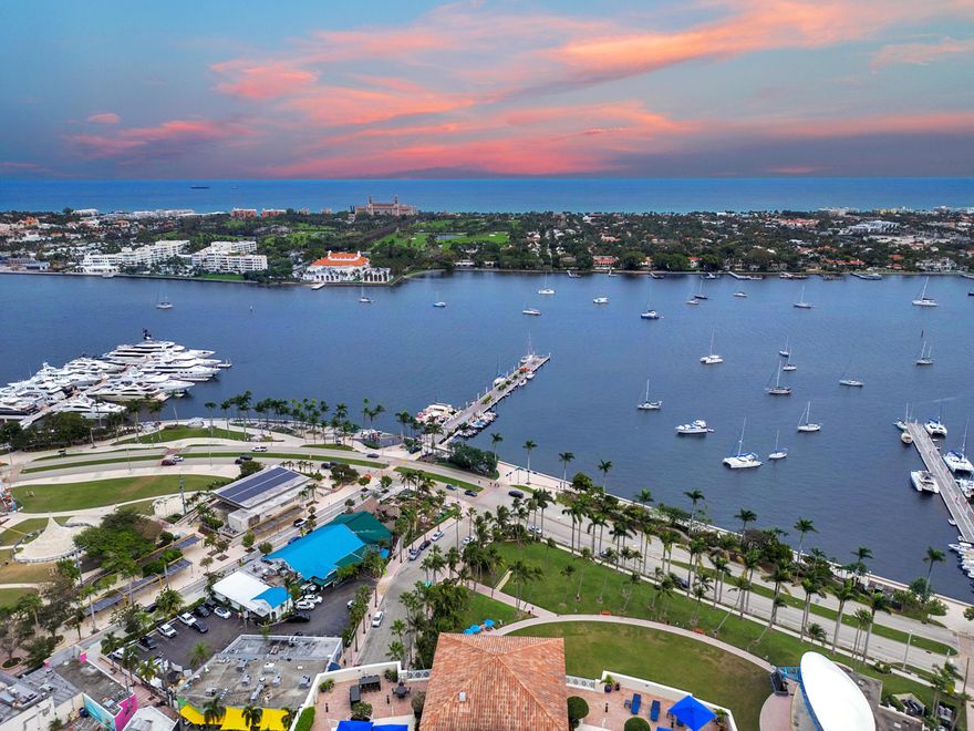 Stunning views from this masterfully renovated 11th floor unit. Private elevator lobby opens directly into the unit. Front section includes a central kitchen, flanked by two living areas and a dining area, in a large open concept space with built-in wet bar. Balcony overlooking intracoastal, ocean, The Breakers and both in-town bridges to Palm Beach Island. Master suite has same water views and incredible sunrises, dual walk-in closets with built-ins. Rear of the unit includes a central powder room, two storage rooms, laundry room and guest bedroom with en-suite bath, large walk-in closet and its own balcony facing west. Building features rooftop pool, club room, fitness center, yoga studio, valet parking, secure garage parking and 24 hour lobby attendant.