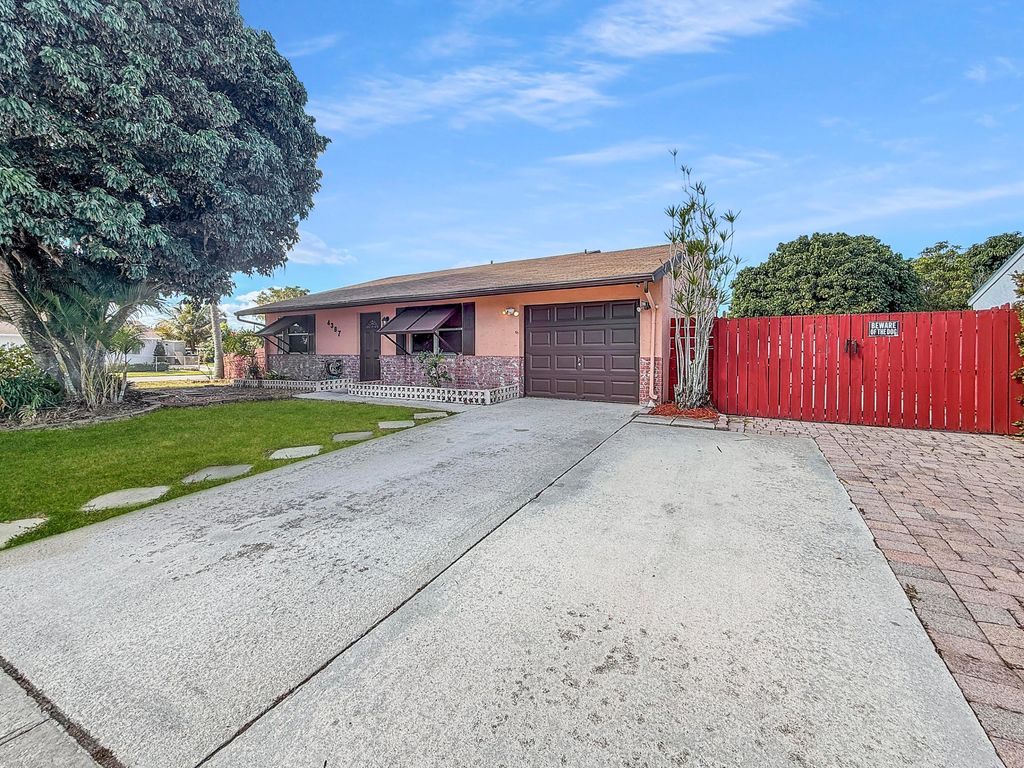 Photo of 4387 Appian Way, Greenacres, FL 33463 (MLS # R11162752)