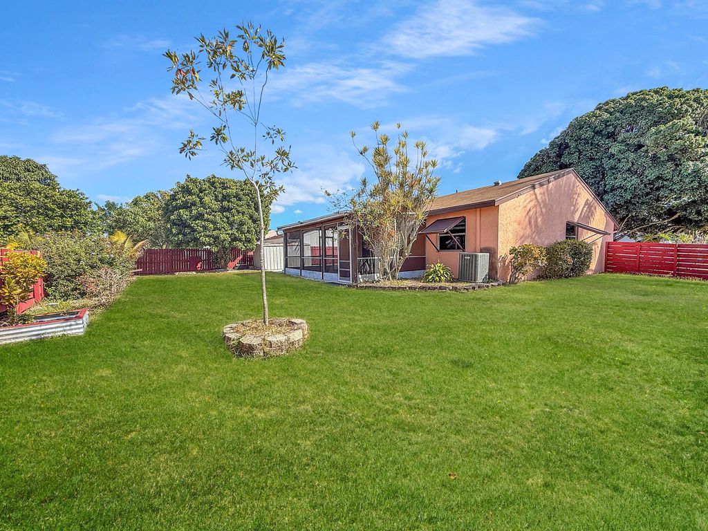 Photo of 4387 Appian Way, Greenacres, FL 33463 (MLS # R11162752)