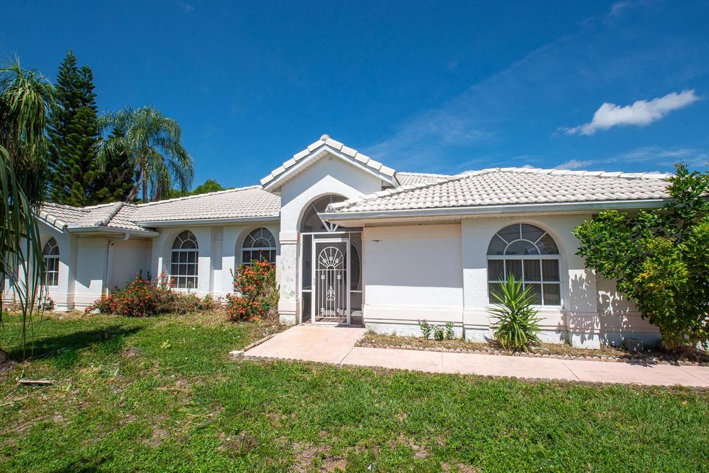 Photo of 2401 SE University Terrace, Port St Lucie, FL 34952 (MLS # R10900650)