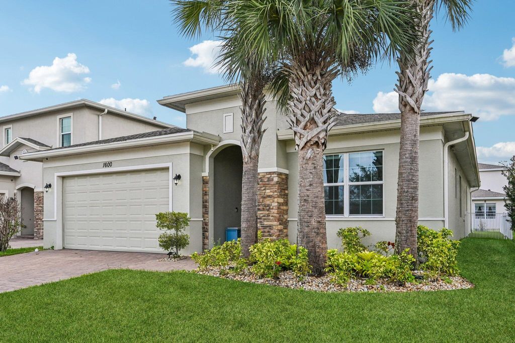 Photo of 1600 NW Vivanco Street, Port Saint Lucie, FL 34986 (MLS # B26001486)