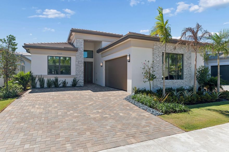 Discover elevated living in the guard-gated community of Lotus Edge, where tropical landscaping and a 90K SF clubhouse with luxury amenities create a true resort-style setting. This never-lived-in Bermuda model offers 3BR/3.5BA plus added living space from a 3rd-car garage delete—ideal for a media room, office, or fitness area—presenting a rare opportunity to own new construction without the builder wait. Soaring ceilings enhance bright, open living spaces, while oversized windows fill the home with natural light. The thoughtfully designed layout is perfect for everyday living and entertaining. The backyard offers space to unwind and create your own outdoor retreat—home offers 2.5” mitered island countertops, pool/spa prewire, gas stub for summer kitchen, plus additional builder upgrades.