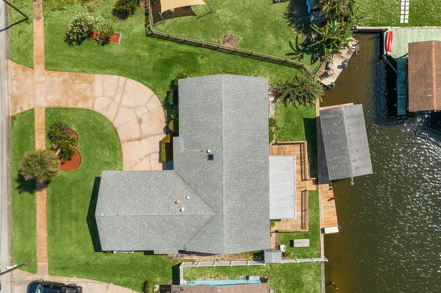 BIG PRICE REDUCTION! MOTIVATED SELLERS: Bring your offers.. CANAL/ INTRACOASTAL ACCESS!! Beautiful open & spacious, 3 bedroom 2 bath UPDATED HOME includes kitchen, large living room/dining room combo, formal dining room, Florida room. Sit on the deck and enjoy the launches and sunsets. DON'T FORGET YOUR BOAT!!! 5,000lb boat lift/boat house. (measurements subject to error)