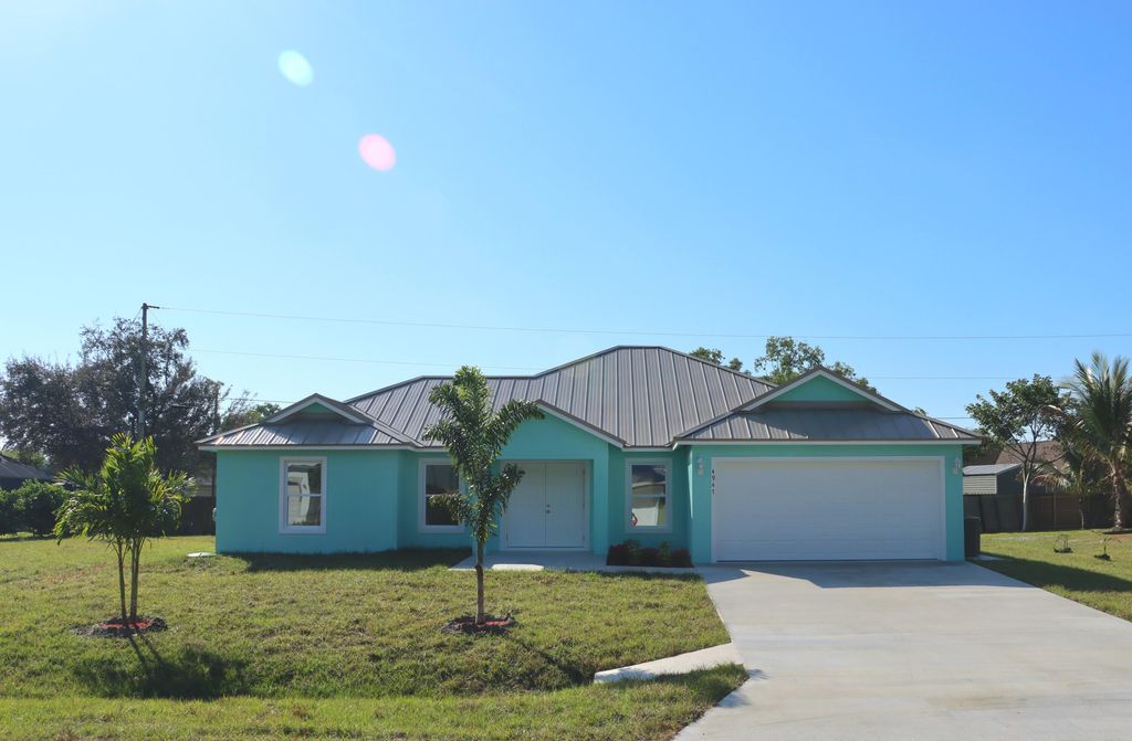 Photo of 4947 NW Flintstone Avenue, Port Saint Lucie, FL 34983 (MLS # R11163558)