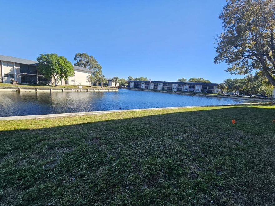 1BR/1.5BA first-floor condo in gated Versailles Gardens. Tile floors,  walk-in closet, screened patio, and community pool. Prime Tamarac location close to shopping and highways. Water included.