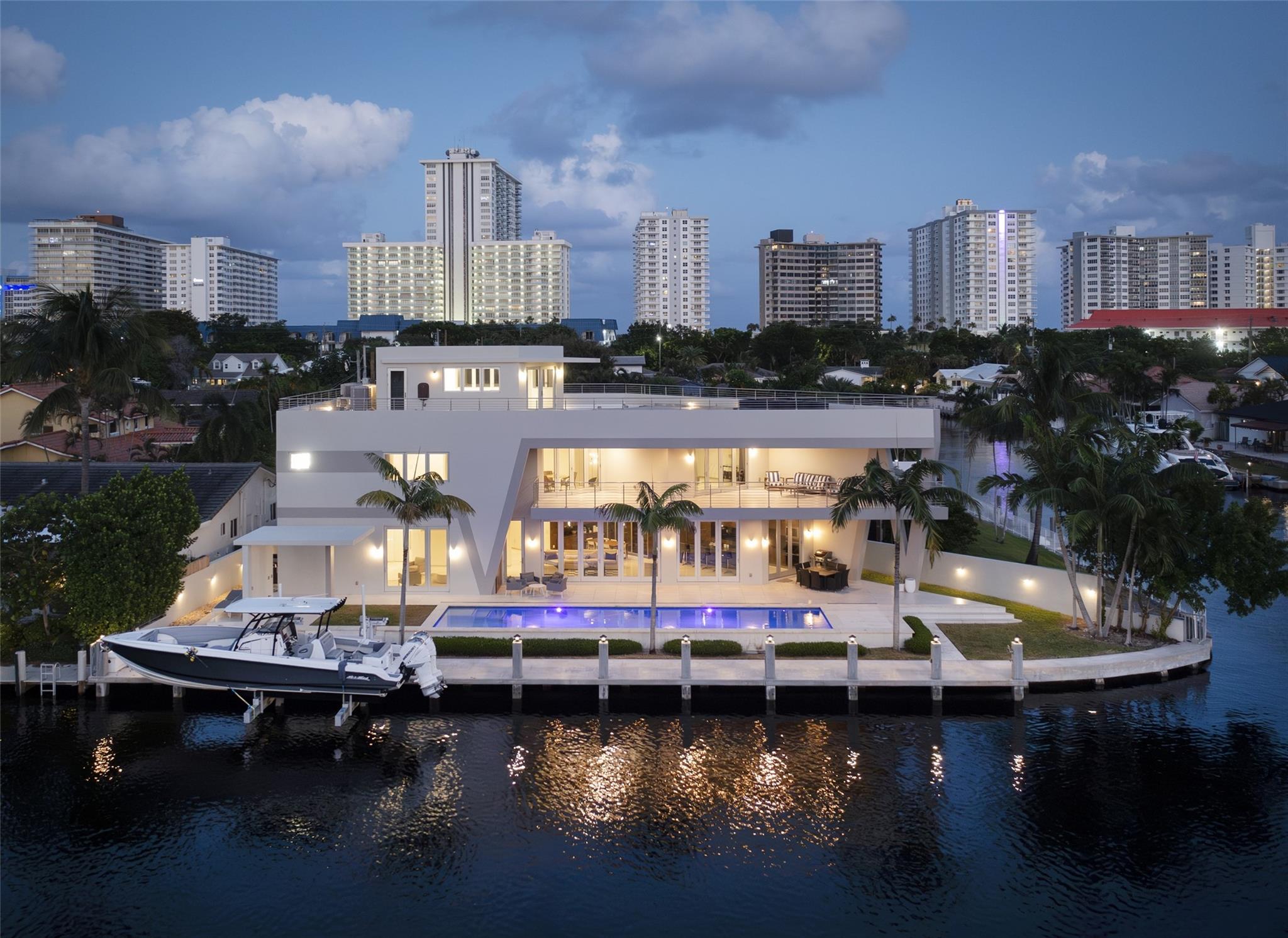 AVAILABLE IMMEDIATELY FOR ANNUAL LEASE AT 30K MONTHLY, LEASE OPTION, OR PURCHASE. FULLY FURNISHED. DIRECT INTRACOASTAL VIEWS | IMPACT GLASS | 48K FULL HOUSE GENERATOR | ELEVATOR TO ALL 3-LEVELS | 50± FT HEATED POOL | SHORT WALK TO THE BEACH & PATIO BARS ON THE GALT OCEAN. 135± DEEPWATER FRONTAGE FITS 80-100± FT YACHT & APPROX 24K BOAT LIFT. FLOOR-TO-CEILING IMPACT GLASS DOORS | MARBLE FLOORS. KITCHEN HAS 14± FT LEMURIAN BLUE GRANITE ISLAND TOP | COVERED OUTDOOR DINING OUTDOOR PATIO. PRIMARY BEDROOM ON UPPER LEVEL HAS DIRECT INTRACOASTAL VIEWS & LARGE COVERED TERRACE. THREE ADDITIONAL BEDROOM SUITES & UPSTAIRS MEDIA OR DINING AREA. THIRD LEVEL HAS EXPANSIVE TREX COMPOSITE DECK + ELEVATOR ACCESS WITH VIEWS OF ICW & GALT OCEAN SKYLINE. MATTEPORT VIRTUAL TOUR & FLOOR PLANS ATTACHED.