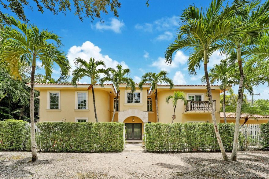 Elegant Mediterranean two-story home in highly sought after North Grove. Quiet, higher elevation location situated just 1 block from Biscayne Bay & marinas, minutes from waterfront parks & the booming Coconut Grove Village center. Full ensuite baths and walk-in closets in all bedrooms. All bedrooms with private balconies. Large master w/roman tub & double walk-in closet. Marble flooring throughout 1st floor and beautiful polished hardwood floors on 2nd level. Kitchen has granite countertops and new stainless steel appliances. Covered patio area with built-in gas grill and in-ground pool for entertaining guests. Master + 2 bed/2 bath upstairs, ground level 1 bd/1 ba perfect as a studio. Double garage with brick paver driveway and electric gate. Full impact windows and doors throughout.