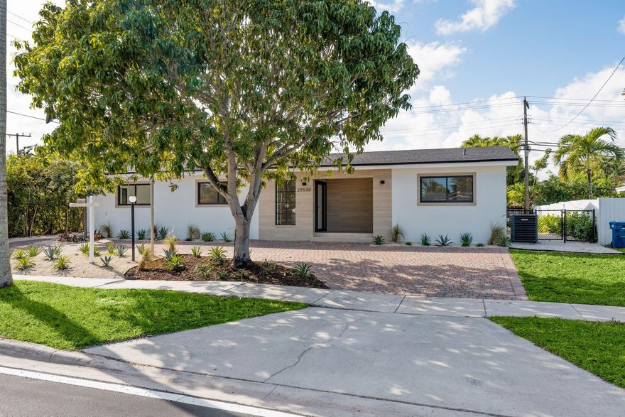 Completely rebuilt from floor to ceiling, this brand-new bespoke residence delivers modern luxury in the highly sought-after Highland Lakes neighborhood. Designed as a true modern masterpiece, the home offers 5 bedrooms, 3.5 designer bathrooms, new roof, new A/C, impact windows, and premium finishes throughout. The stunning kitchen features jade quartzite countertops, Bosch appliances, and custom cabinetry. Sun-filled interiors flow seamlessly to a private resort-style pool, creating an ideal setting for refined living and sophisticated entertaining. Offered with a 1-year builder’s warranty for complete peace of mind, this exceptional home embodies elevated South Florida luxury living.