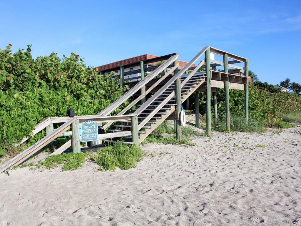 Enjoy 700' of oceanfront beach in a very active 55+ social community. Beautiful top floor unit with elevator access. This condo has been gently used seasonally and is in immaculate condition. You just lock the door and go. Light & airy with charming coastal decor. Crown molding, updated bathroom and kitchen and IMPACT GLASS. LOW HOA (551.71) monthly with a clubhouse, heated pool overlooking the ocean, shuffleboard, exercise/fitness room, gas barbecue & manager on site. Walk the beach every day and get your vitamin D. You are located minutes to restaurants and shopping beachside. A very active community.