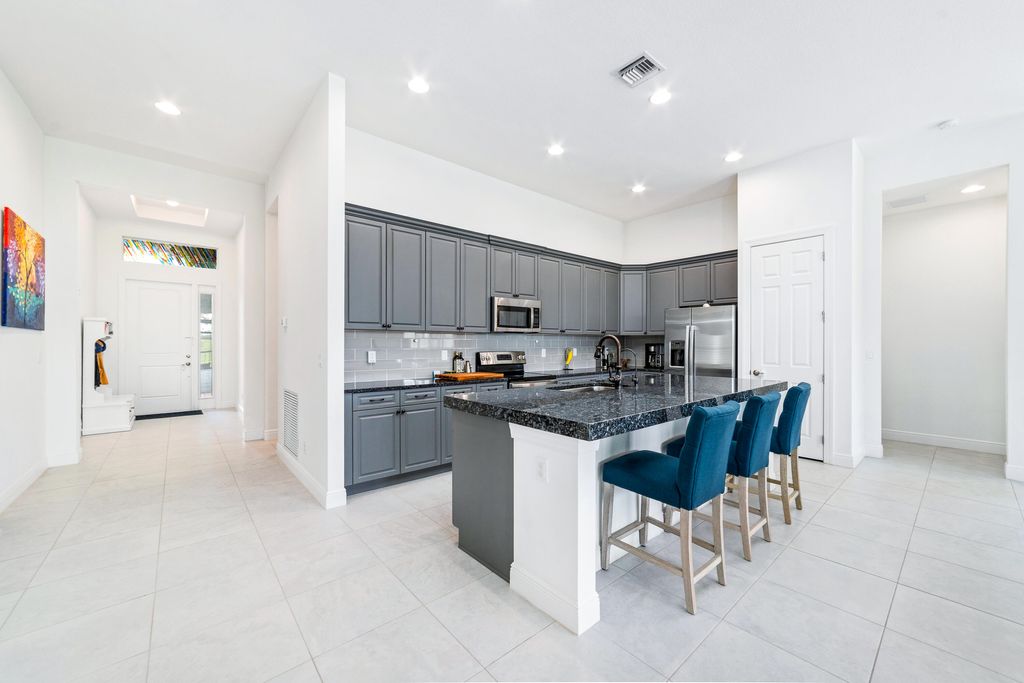 Photo of 9135 SW Pepoli Way, Port Saint Lucie, FL 34987 (MLS # B26004313)