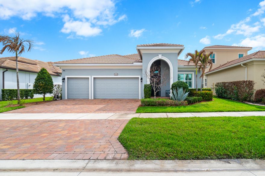 Exceptional living awaits in this beautifully maintained split 3-bedroom, 3-bath residence with a double-door den/office, offering both flexibility and privacy. Designed with comfort and functionality in mind, this spacious home features an open-concept floor plan ideal for modern living. The kitchen is a standout, showcasing abundant cabinetry, granite countertops, stainless steel appliances, a tile backsplash, pantry, and a large center island, perfect for meal preparation and casual gatherings. The adjoining living and dining areas provide an inviting space for entertaining, enhanced by volume ceilings that create a bright, expansive feel throughout. The water softener and Reverse Osmosis water filtration is a plus you will enjoy.  A relaxed Key West-inspired ambiance is evident with plantation shutters and a generously sized screened patio, ideal for enjoying indoor-outdoor living year-round. The completely fenced, oversized backyard provides many future options for pool or landscaping, while the paver driveway leads to a spacious 3-car garage. Located in the highly desirable Verano South community, residents enjoy a true country club lifestyle with resort-style amenities for all ages, all within a guard/code gated setting that provides both security and peace of mind.