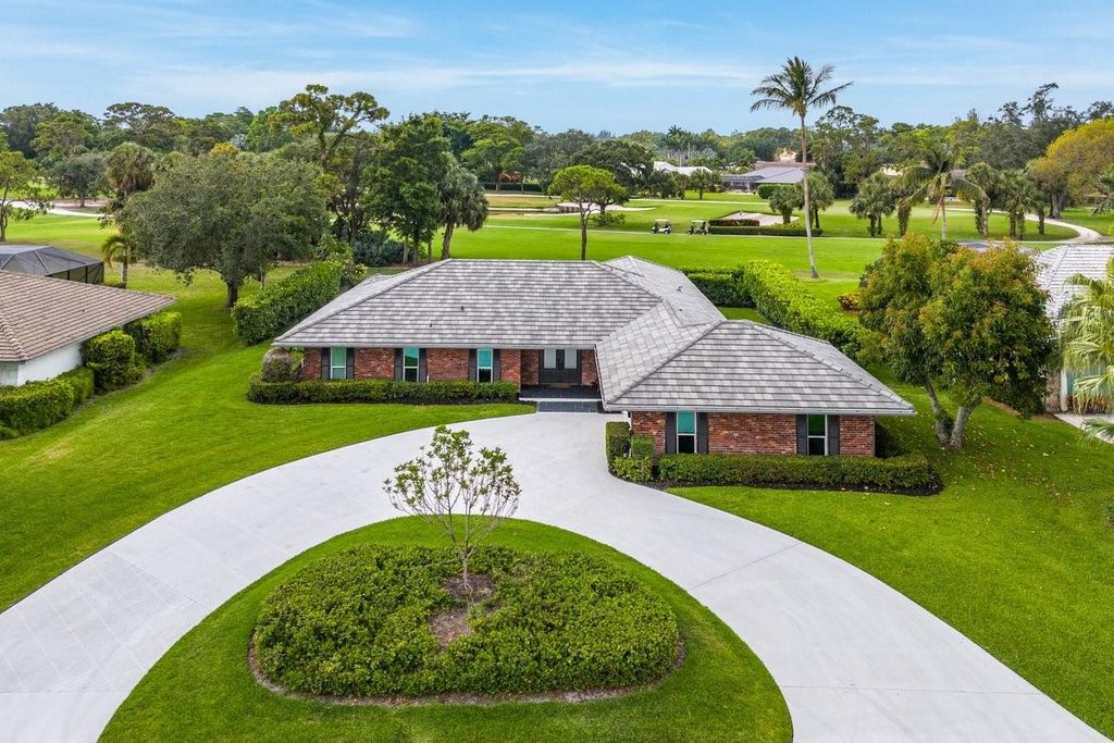 Photo of 525 Muirfield Drive, Atlantis, FL 33462 (MLS # F10440829)