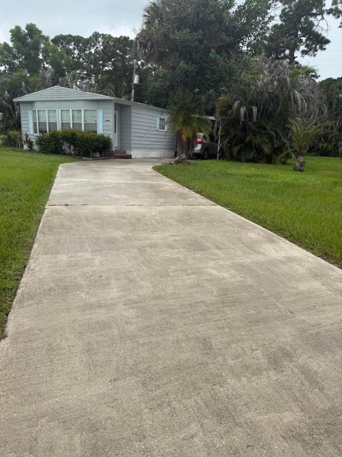 Photo of 11 SE La Mesa LN, Port Saint Lucie, FL 34952 (MLS # B26070121)