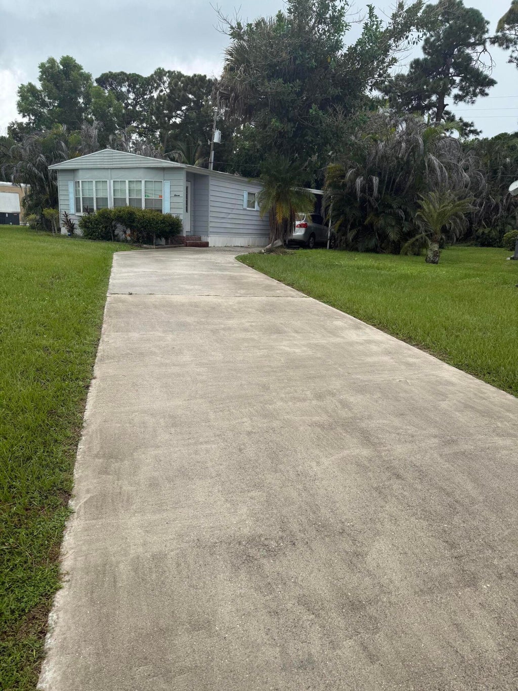 Photo of 11 SE La Mesa LN, Port Saint Lucie, FL 34952 (MLS # B26070121)