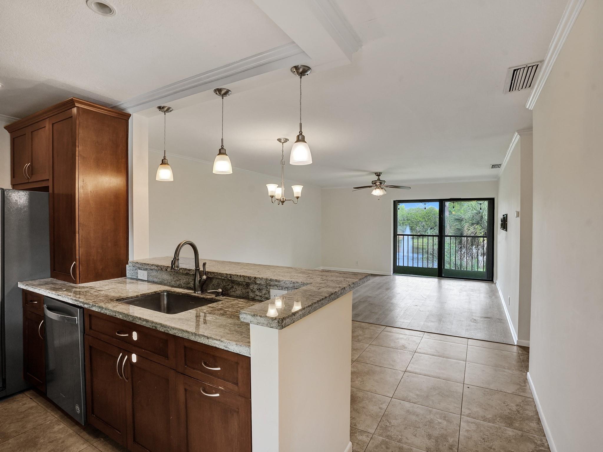 Discover Boca Terrace, a hidden gem in Boca Raton offering a premium location at an affordable price. This exquisite corner unit features 2 bedrooms, 2 bathrooms, and well appointed finishes. Every room is freshly painted and accentuated with ivory crown molding. The private balcony, adorned with high-quality turf and bistro lights, overlooks a most tranquil lake. The interior boasts tile floors in the living space and luxury vinyl plank in the bedrooms blending comfort and style. The open kitchen features cherry wood cabinets, stainless steel appliances and granite countertops. Ideally situated in the most coveted part of town, you're zoned for A-rated schools, 5 minutes from the beach, downtown Boca Raton, Town Center Mall and right across the street from Sugar Sand Park. Now Leasing!